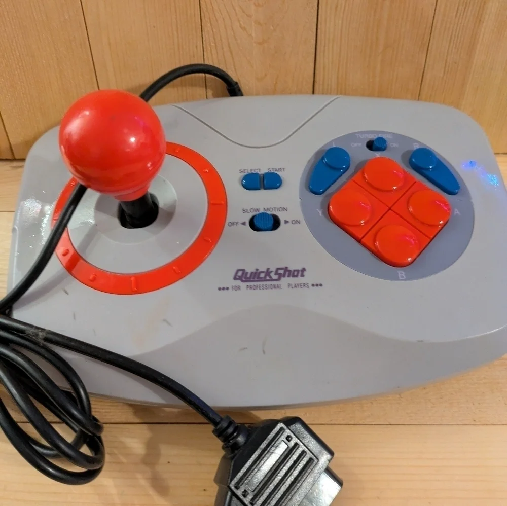 Gray and Red Joystick Controller